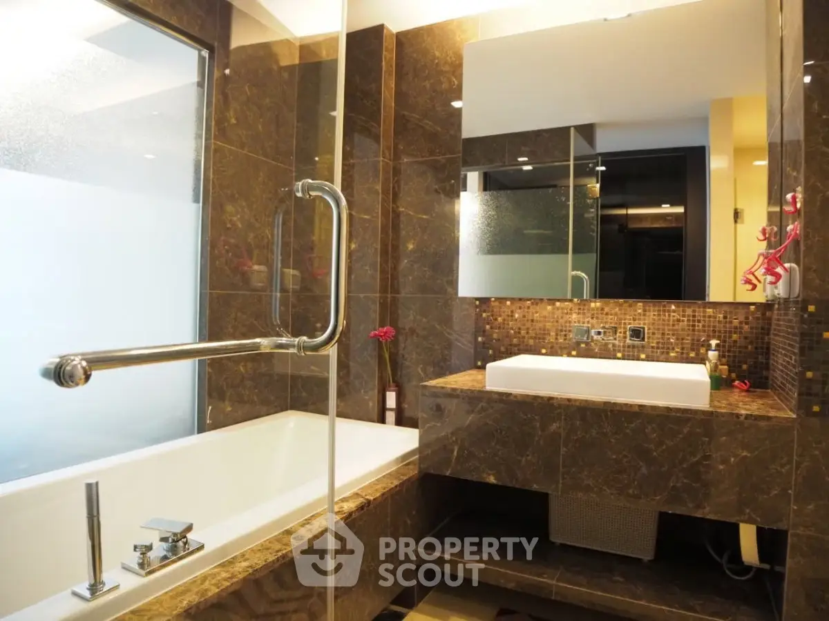 Luxurious bathroom with marble finishes and modern fixtures