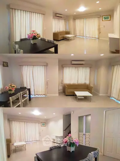 Spacious living room with elegant curtains and modern furniture in a bright, airy setting.