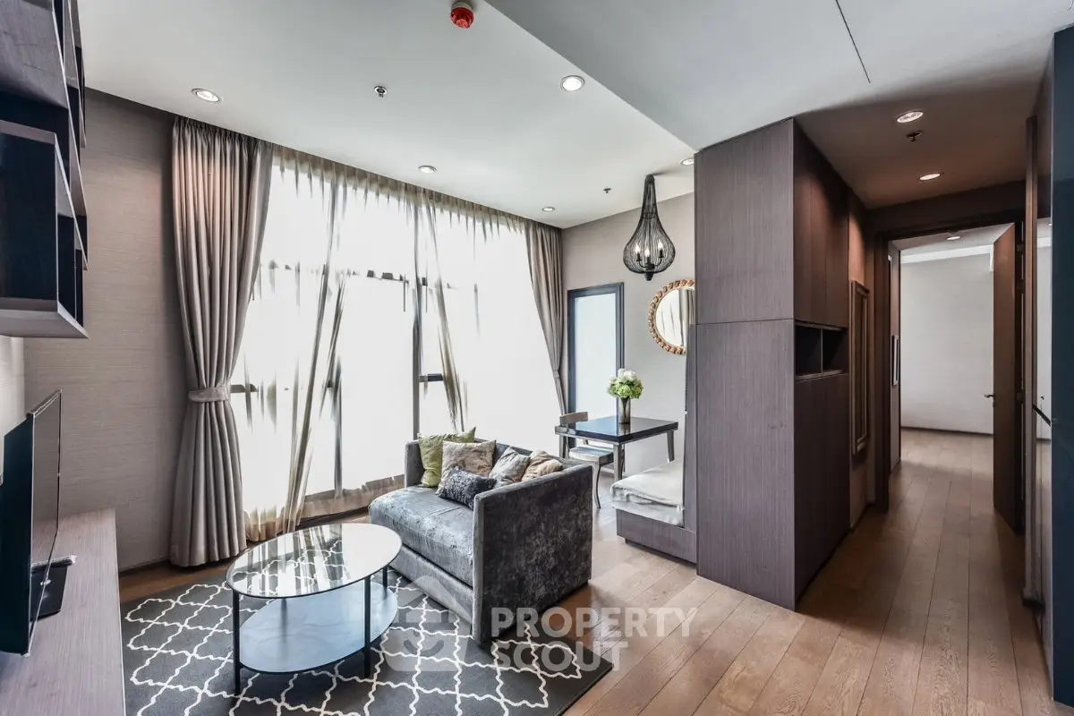 Modern living room with elegant decor and large windows in a stylish apartment.