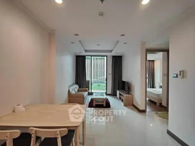 Spacious modern living room with open layout and stylish furniture, perfect for comfortable living.