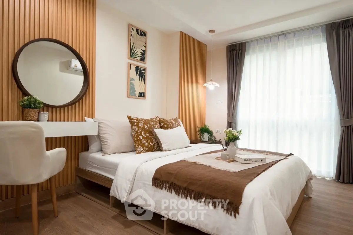Elegant bedroom with modern decor, featuring a cozy bed, stylish wall art, and natural light from large windows.