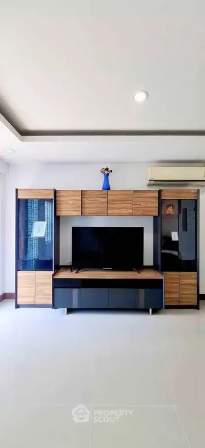 Modern living room with sleek entertainment center and minimalist decor