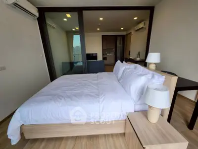 Modern bedroom with sleek design and spacious layout in a contemporary apartment.