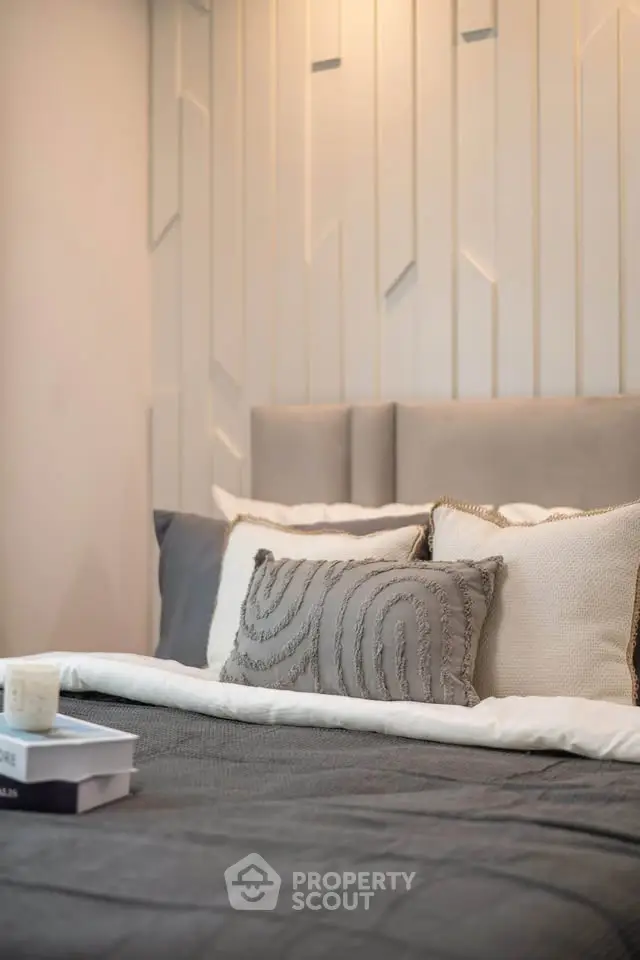 Luxurious bedroom with stylish decor and plush pillows