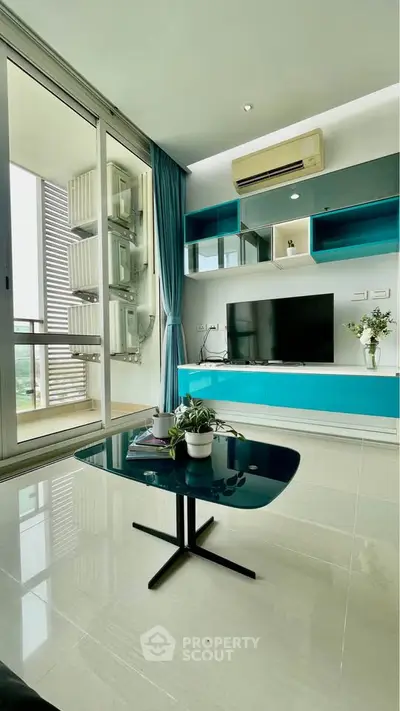 Modern living room with sleek furniture and balcony view