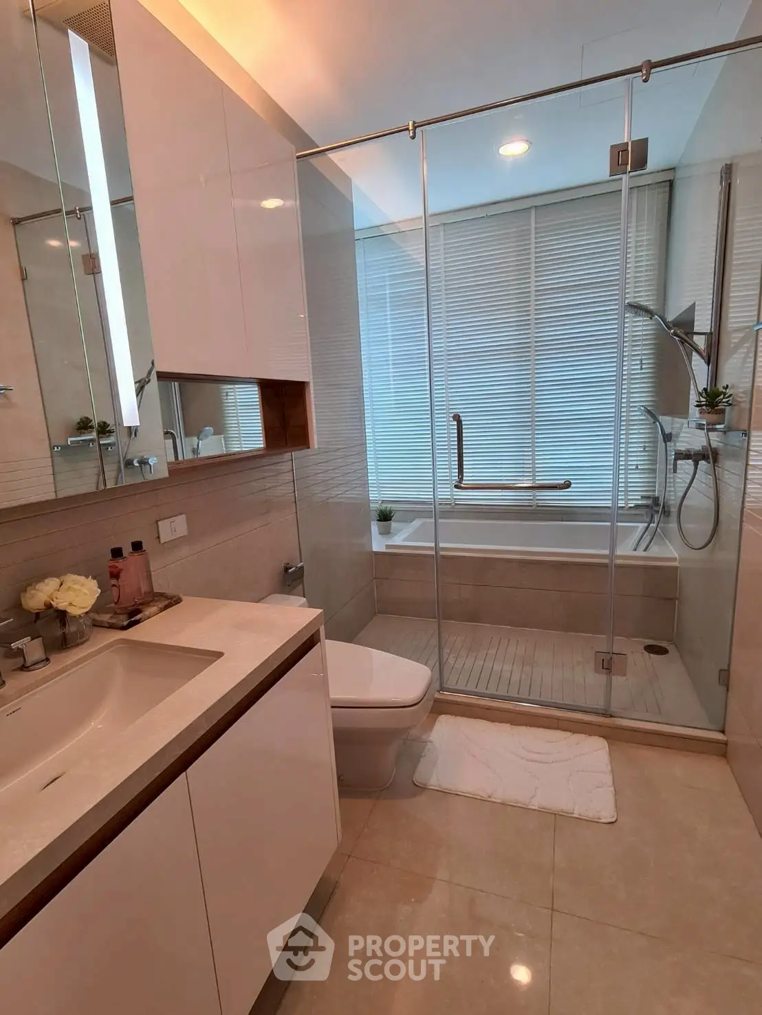 Luxurious modern bathroom with glass shower and elegant fixtures