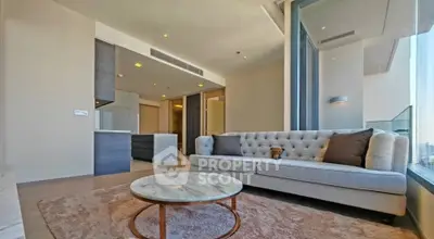 Luxurious modern living room with stunning city view and elegant furnishings.