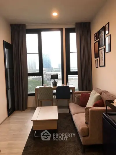 Cozy living room with large windows and stylish decor in modern apartment