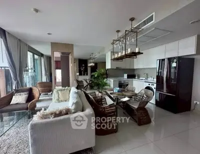 Luxurious open-plan living room with modern kitchen and stylish decor