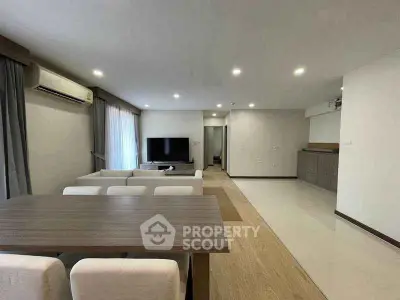 Spacious modern living room with dining area and sleek design