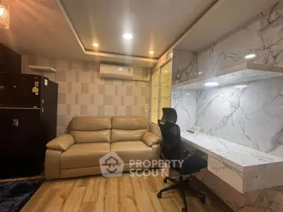 Modern living room with stylish marble wall, cozy leather sofa, and sleek workspace.