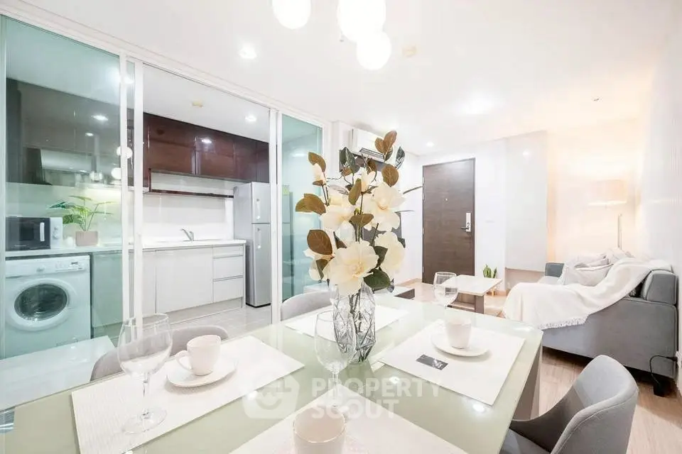 Modern open-plan living and kitchen area with stylish decor and appliances