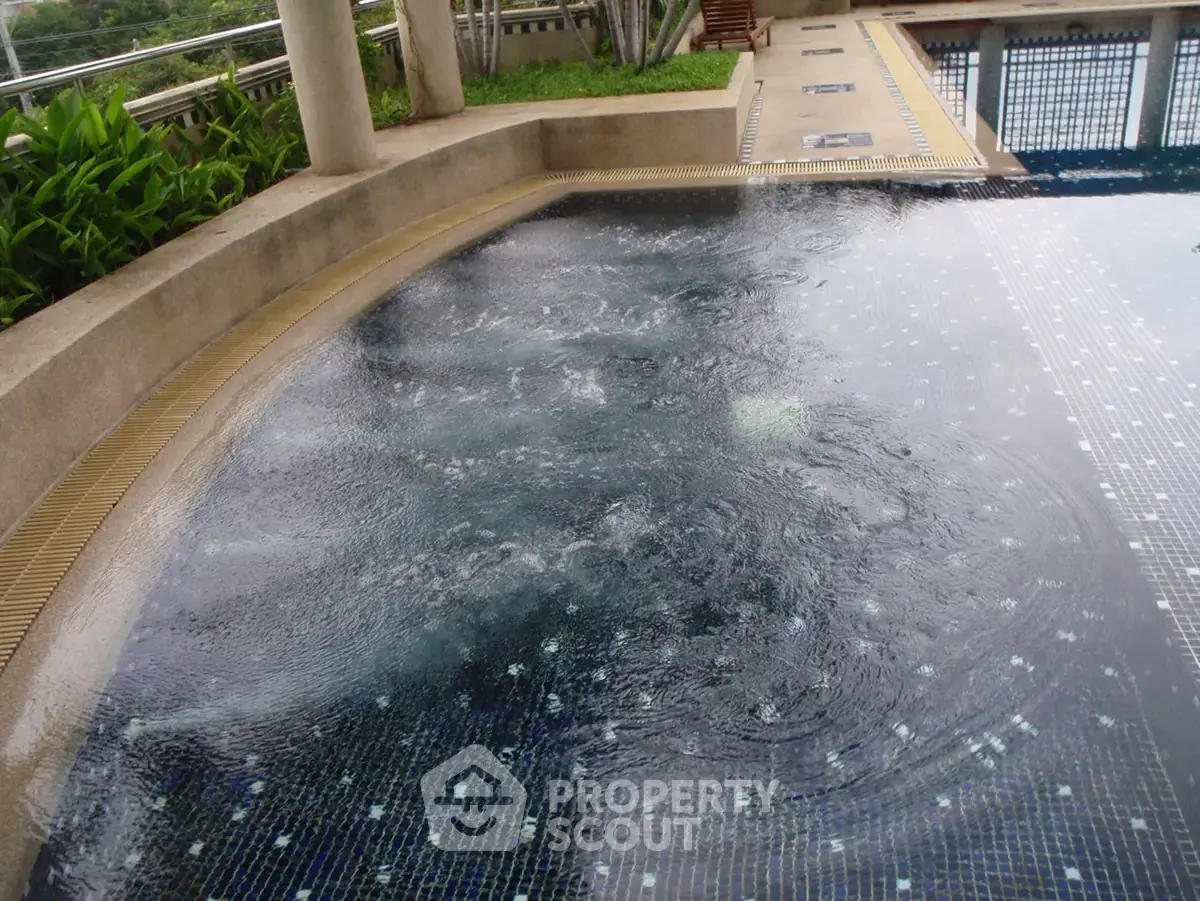 Luxurious outdoor pool with modern design and serene surroundings, perfect for relaxation and leisure.