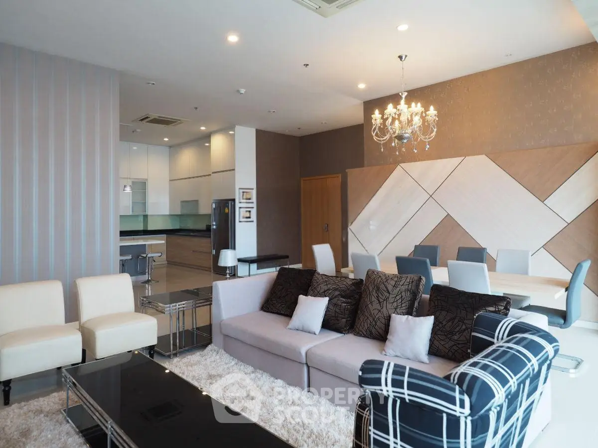 Luxurious open-plan living room with elegant decor and modern kitchen