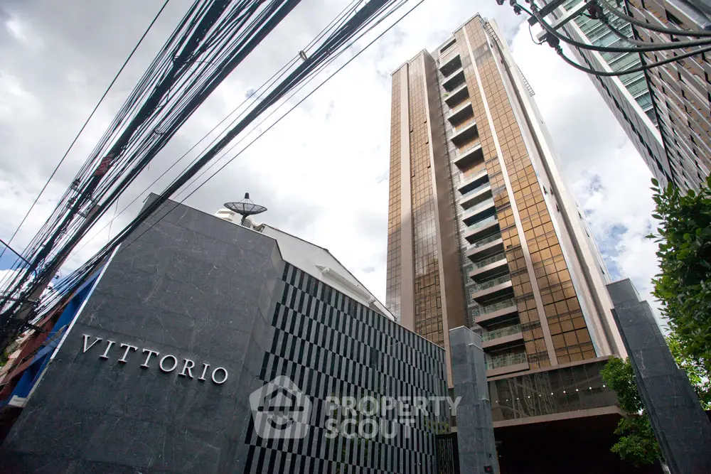 Luxurious high-rise building with modern architectural design and sleek facade.