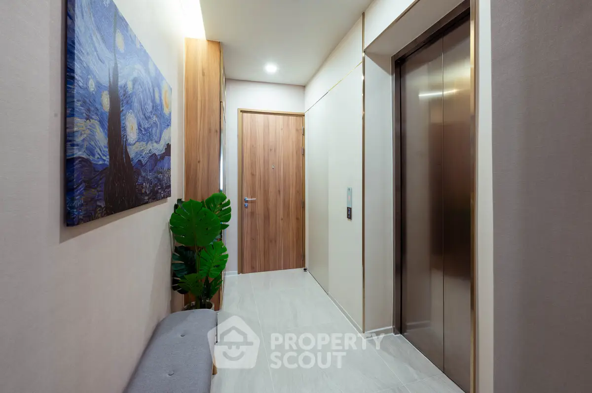 Modern apartment entrance with stylish decor and elevator access