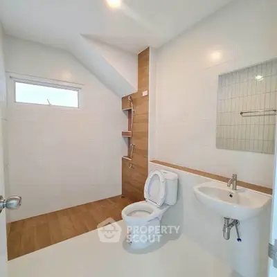 Modern minimalist bathroom with sleek design and wooden accents