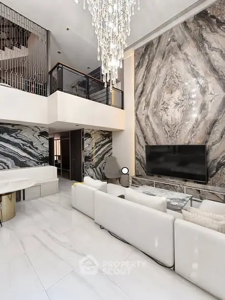 Luxurious living room with high ceilings and elegant marble accents