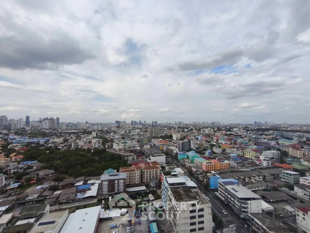 Stunning cityscape view showcasing vibrant urban skyline and diverse architecture under a cloudy sky.
