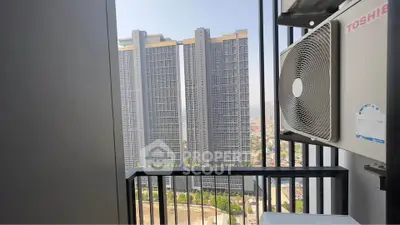 Modern high-rise view from balcony with air conditioning unit, showcasing urban living.