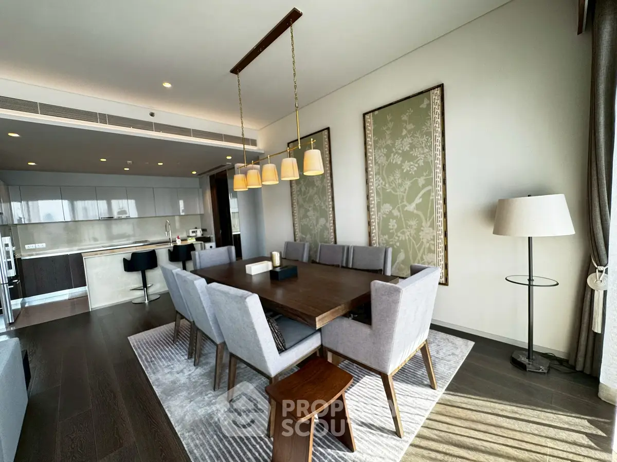Luxurious modern dining room with elegant lighting and open kitchen layout