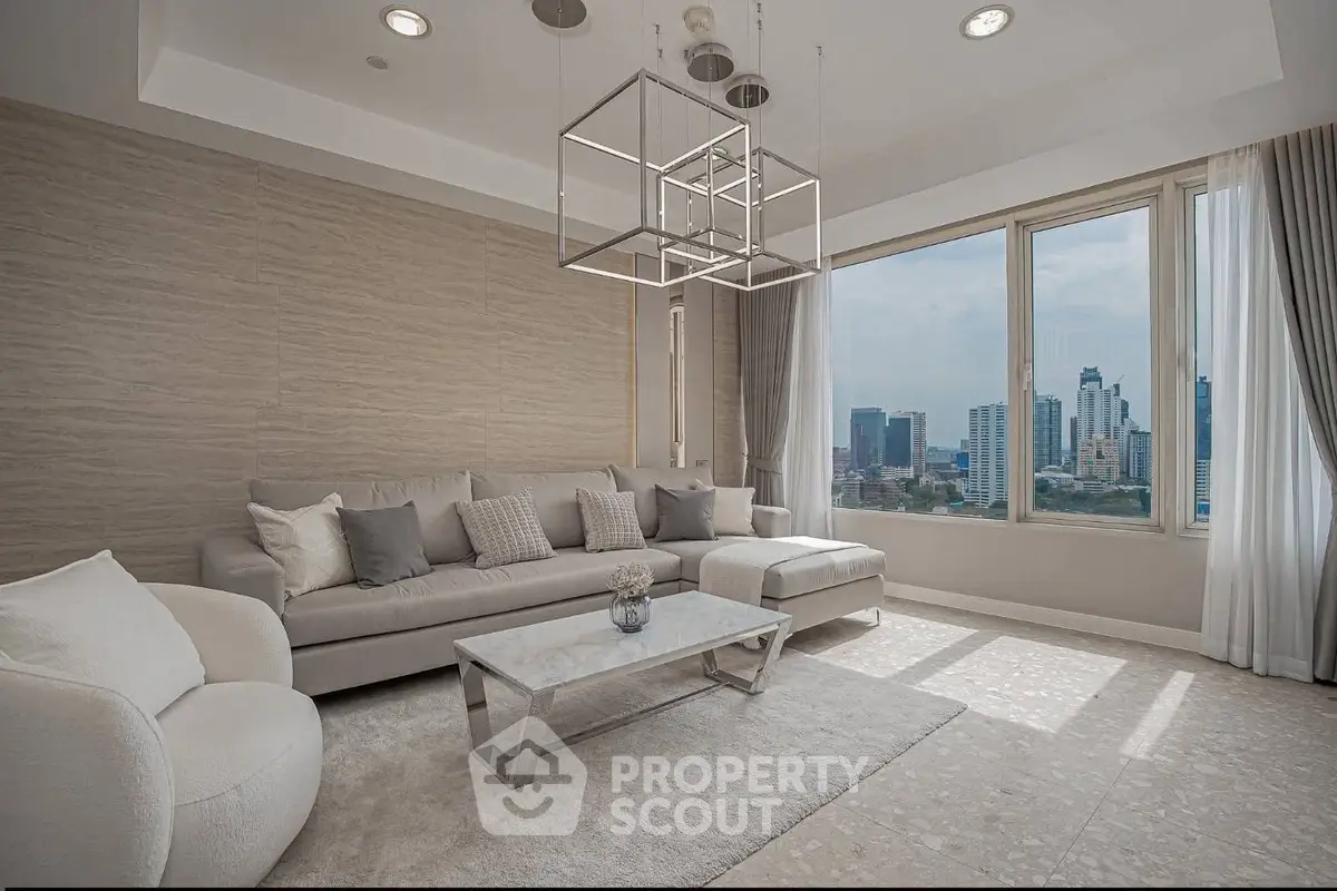 Luxurious modern living room with city view, elegant furniture, and stylish lighting in high-rise apartment.