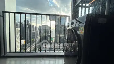 High-rise balcony with stunning city view and modern washing machine.