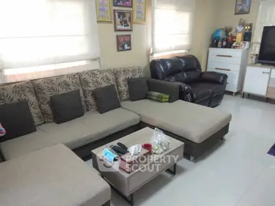 Spacious living room with modern sectional sofa and cozy decor