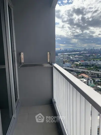 Stunning cityscape view from a modern high-rise balcony, perfect for urban living.