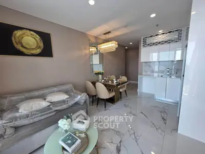Luxurious modern living room with elegant dining area and sleek kitchen in open layout design.