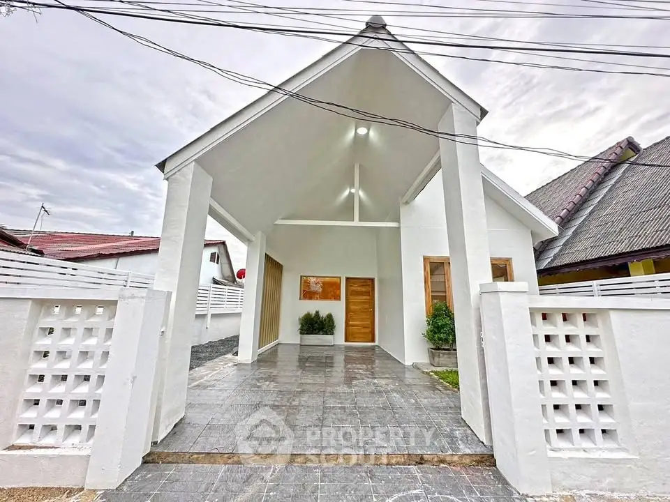 Charming modern white house with spacious driveway and minimalist design