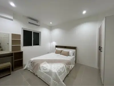 Modern bedroom with minimalist design and cozy ambiance