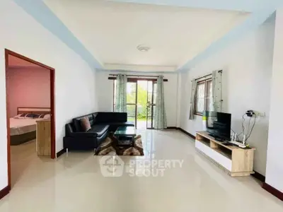 Spacious living room with modern furniture and natural light