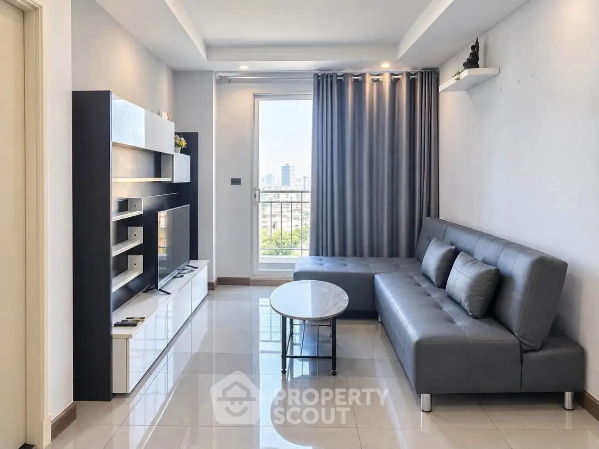 Modern living room with sleek furniture and city view, perfect for urban living.