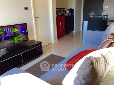 Modern living room with stylish furniture and vibrant decor in a cozy apartment setting.