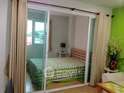 Cozy bedroom with sliding glass doors and vibrant green accents