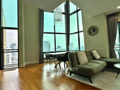 Luxurious high-rise living room with stunning city views and modern decor.