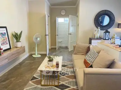 Cozy living room with modern decor and open view to bathroom
