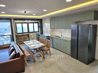 Modern open layout kitchen and dining area with city view, featuring sleek appliances and stylish furniture.