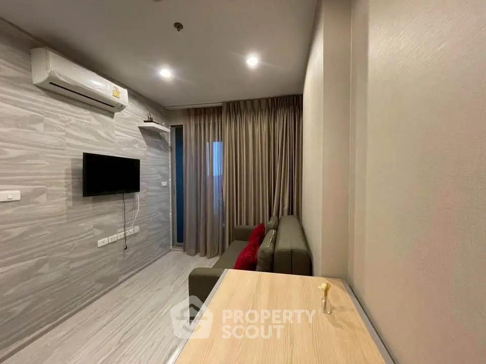 Modern living room with sleek design and wall-mounted TV