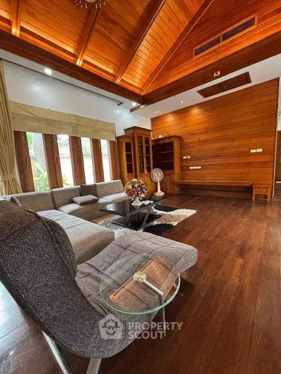 Luxurious living room with wooden ceiling and modern furniture