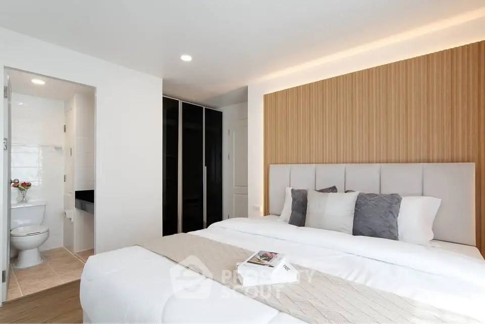 Modern bedroom with ensuite bathroom and stylish decor