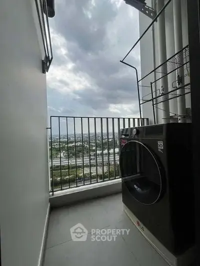 Modern balcony with washing machine and stunning city view, perfect for urban living.