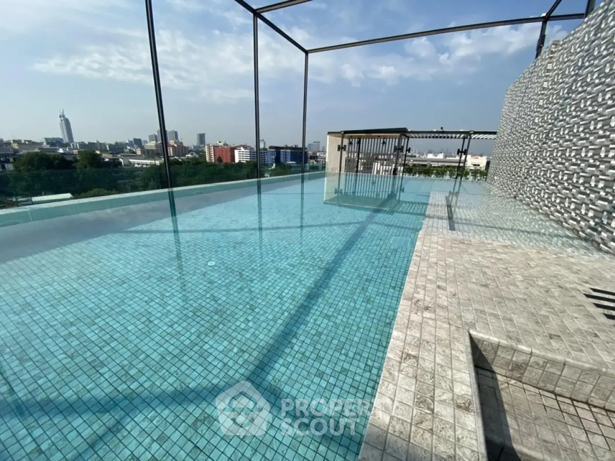 Stunning rooftop infinity pool with panoramic city views and modern design.