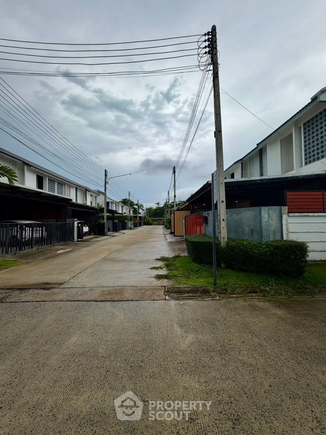 Charming residential street with modern houses and lush greenery, perfect for serene living.