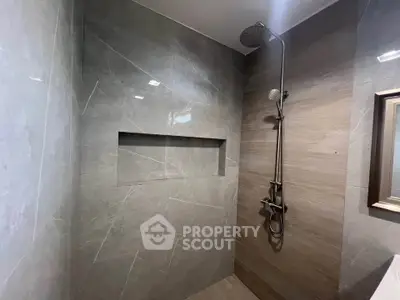 Modern bathroom with sleek shower design and elegant tile work