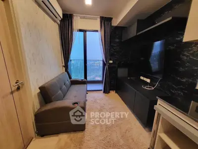 Modern living room with balcony view and sleek entertainment setup