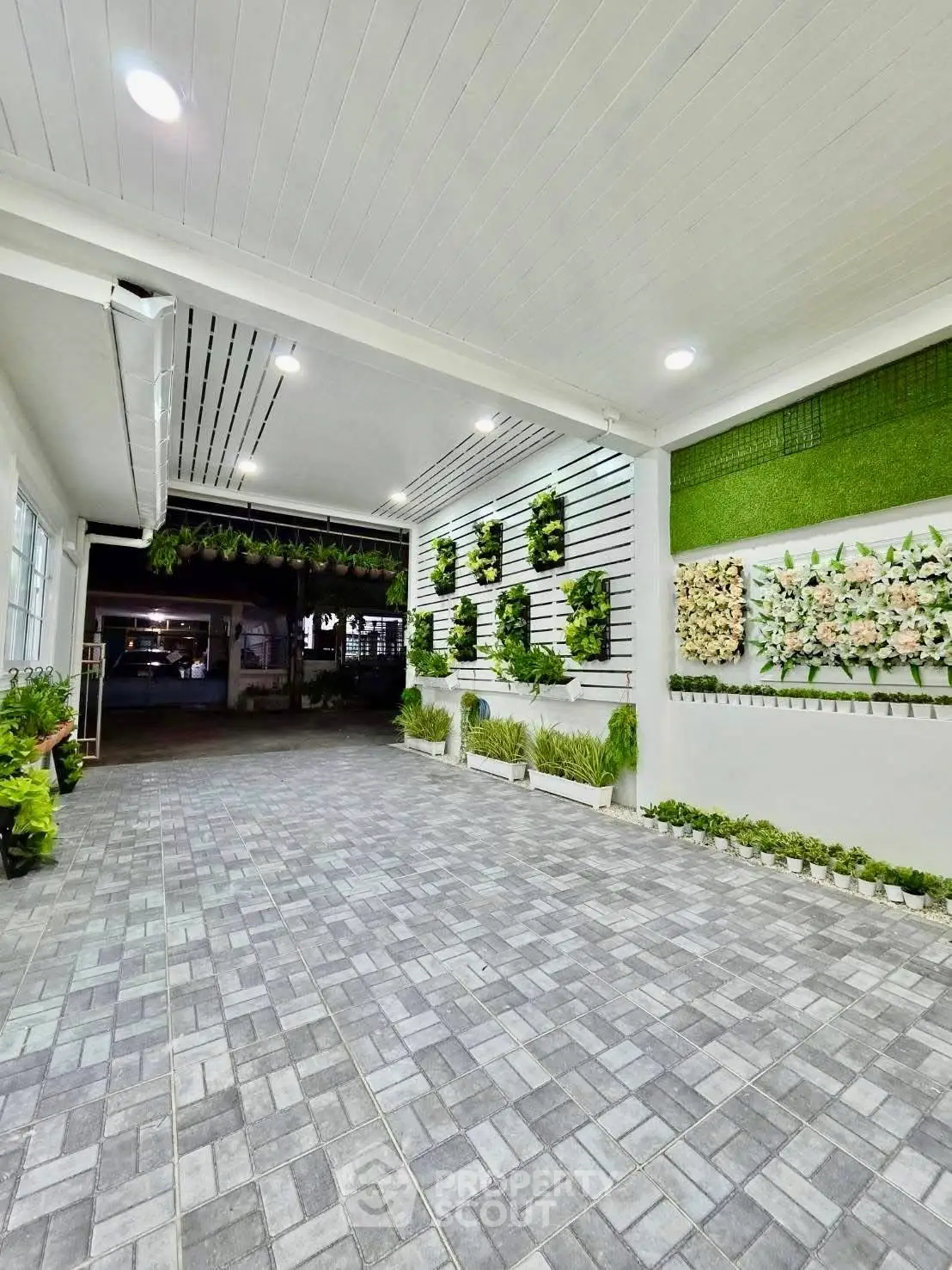 Stylish modern entrance with elegant wall decor and tiled flooring