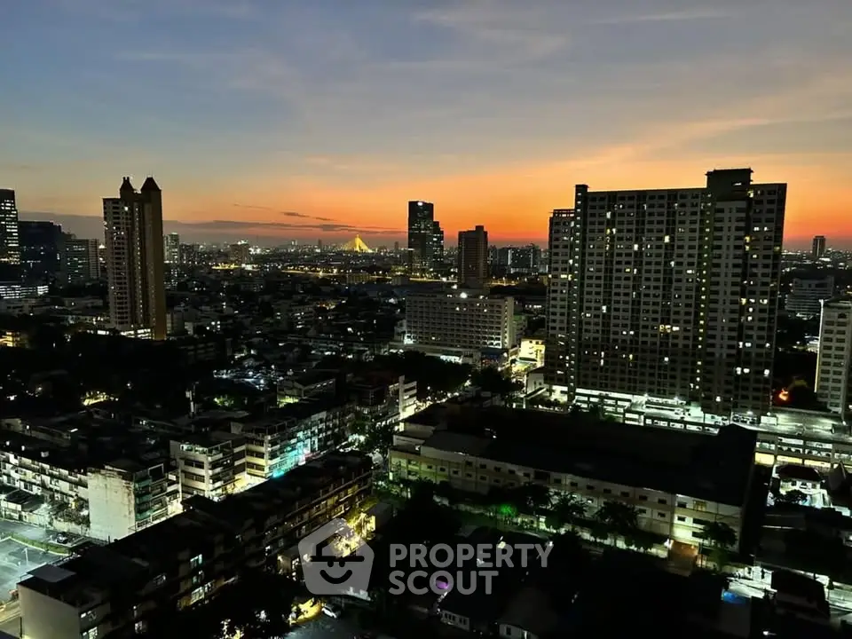 Stunning cityscape view at sunset showcasing high-rise buildings and vibrant skyline.