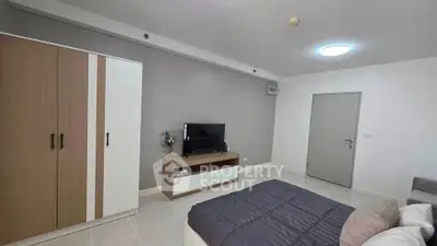 Modern bedroom with sleek wardrobe and cozy bed in minimalist design.